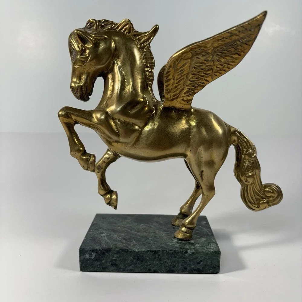 vintage solid brass Pegasus figurine mounted on a green marble base,